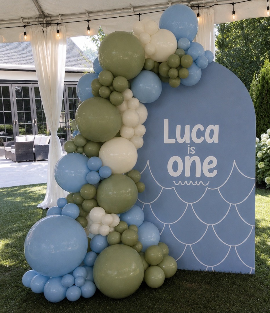 Petite package backdrop — pastel balloon garland with custom sign